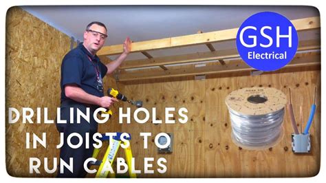 drilling a hole for electrical box into a rafter|drilling holes for rafters.